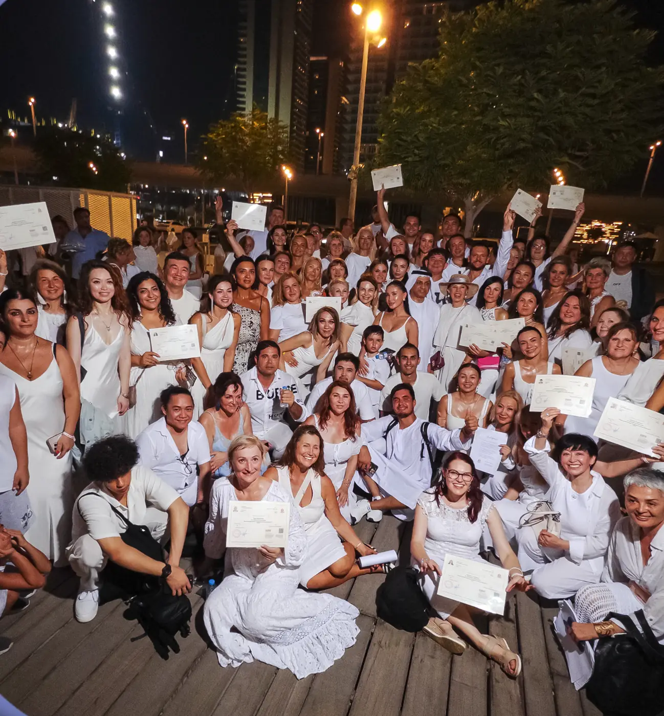 Syucai Training Institute graduates holding certificates